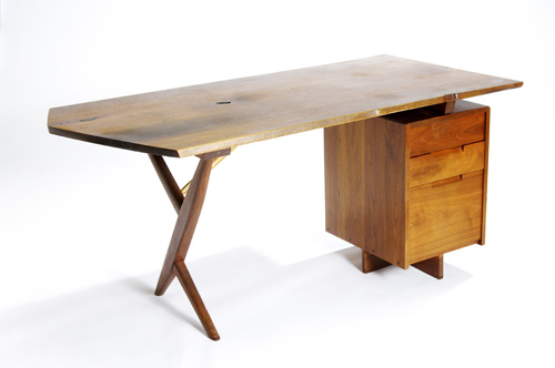 Appraisal: GEORGE NAKASHIMA Walnut Conoid desk with natural occlusion to top