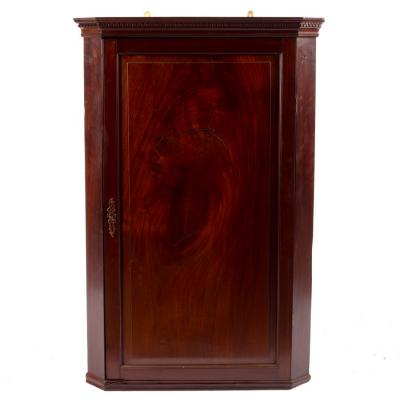 Appraisal: An early th Century mahogany corner cupboard with Greek key