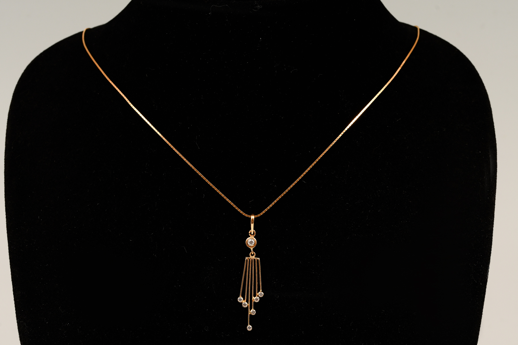 Appraisal: K YELLOW GOLD DIAMOND PENDANT AND CHAIN Pendant contains round