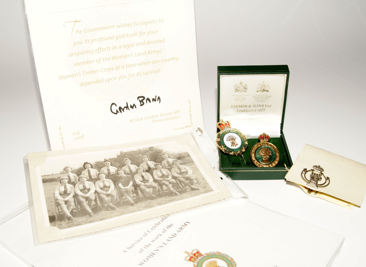 Appraisal: Land Army interest including two gilt and enamelled badges group