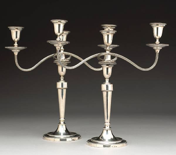 Appraisal: A George III silver pair of candlesticks with matching George