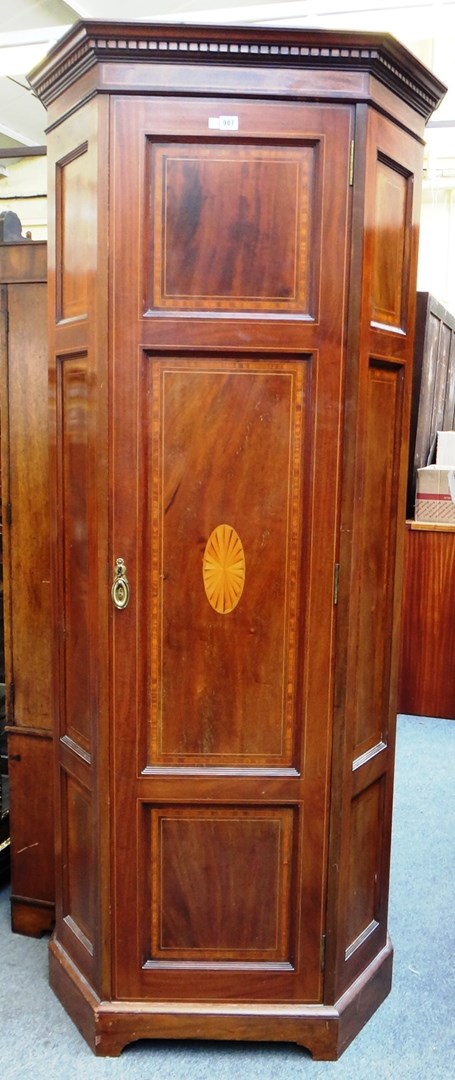 Appraisal: An Edwardian satinwood banded mahogany single door corner cupboard on