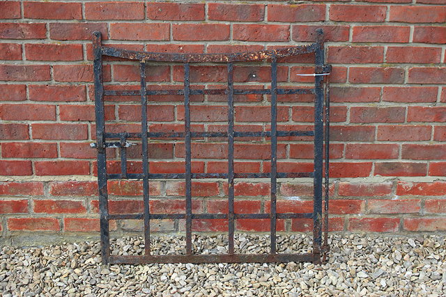 Appraisal: AN OLD BLACK PAINTED WROUGHT IRON GATE of strapwork form