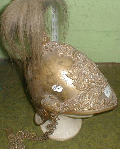 Appraisal: A brass Dragoons guards helmet with plume