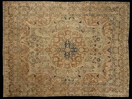 Appraisal: TABRIZ MEDALLION CARPET The black and pale brown floral medallion