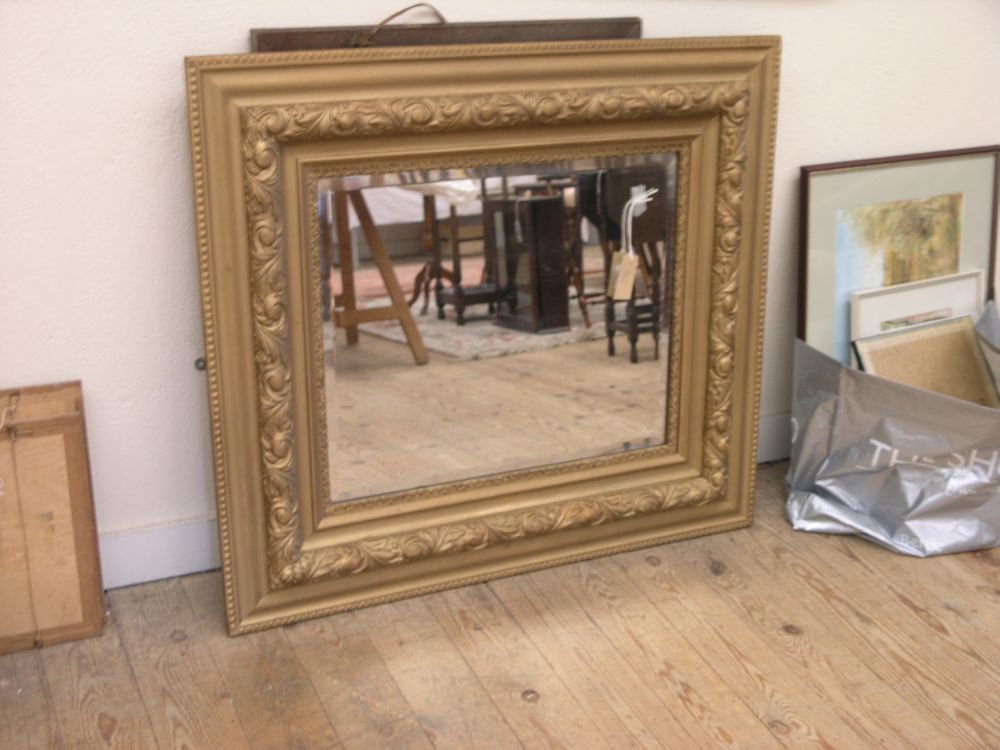 Appraisal: A large gilded mirror moulded with plants x in and