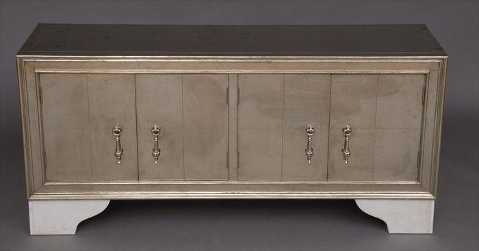 Appraisal: TH CENTURY SILVERED-METAL CLAD SIDE CABINET BY PAUL MATHIEU Enclosed