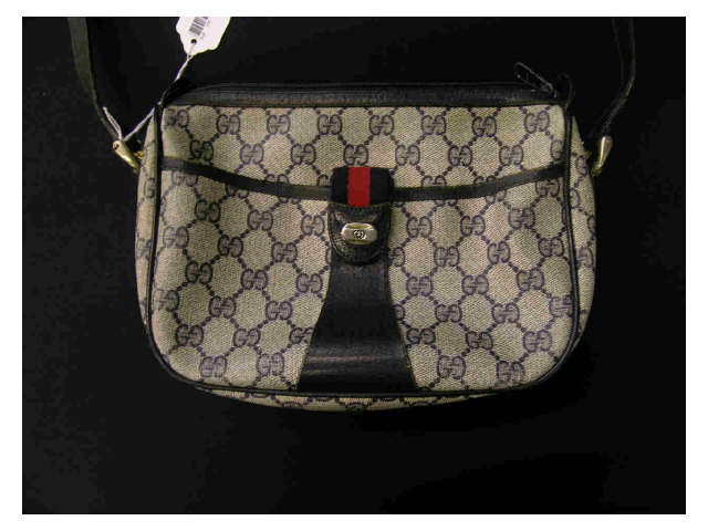 Appraisal: Gucci handbag blue monogrammed vinyl exterior snap pocket zipper closure