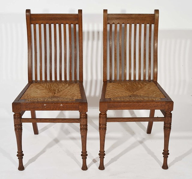 Appraisal: A PAIR OF OAK ARTS AND CRAFTS STANDARD CHAIRS each