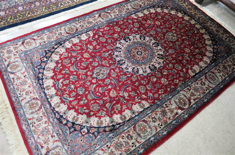 Appraisal: HAND KNOTTED ORIENTAL AREA RUG Pakistani Persian central medallion and