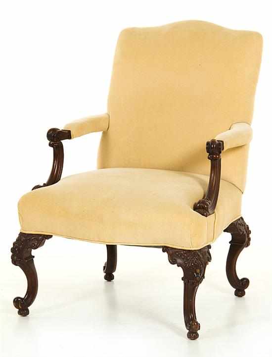 Appraisal: Georgian style carved walnut armchair early th century shaped upholstered