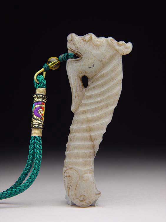 Appraisal: JADE DRAGON PENDANT Chinese carved jade pendant of a stylized