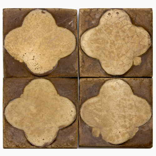 Appraisal: GRUEBY Forty tiles with a raised clover pattern in ivory