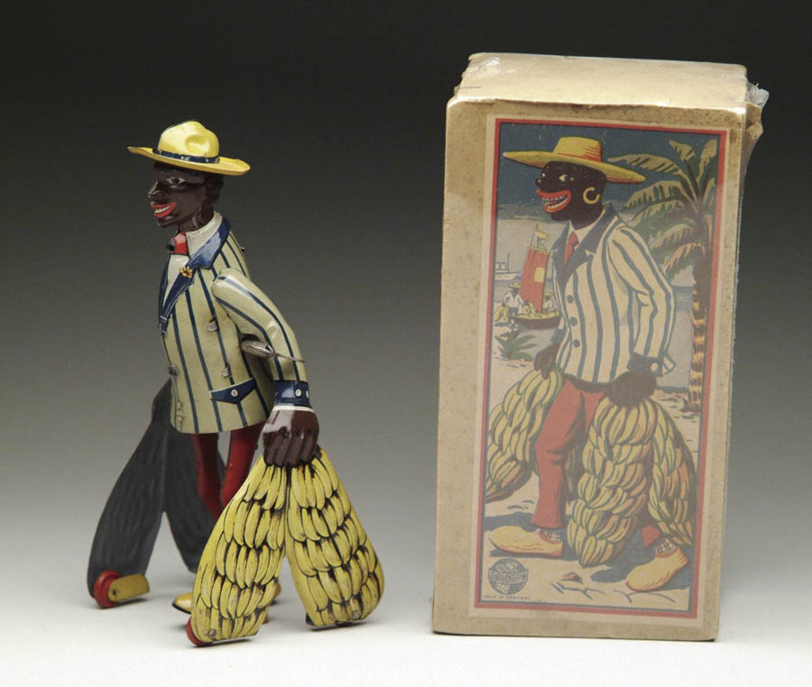 Appraisal: DISTLER BANANA MAN WINDUP WITH OB Brightly lithographed black man