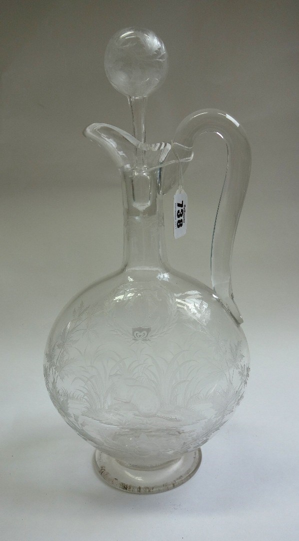 Appraisal: An engraved glass water carafe and stopper of pilgrim flask