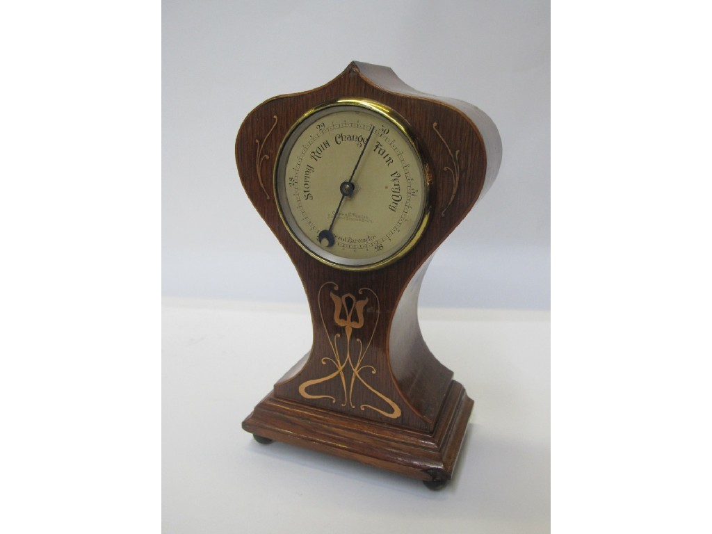 Appraisal: An Art Nouveau mantle aneroid barometer by Curry Paxton of