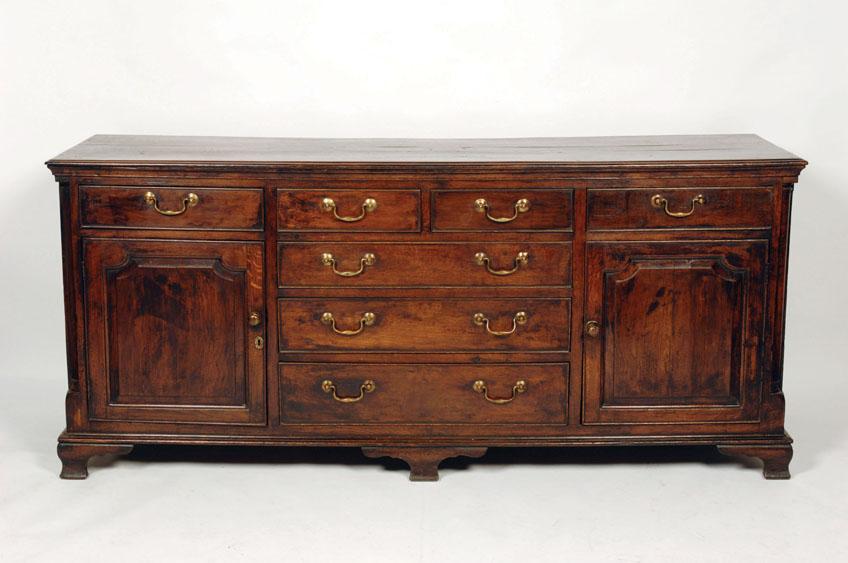 Appraisal: A GEORGE III OAK DRESSER BASE the rectangular top with