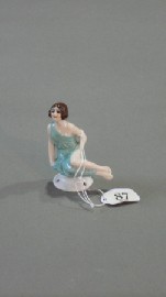 Appraisal: A German porcelain Art Deco figure of a seated nymph