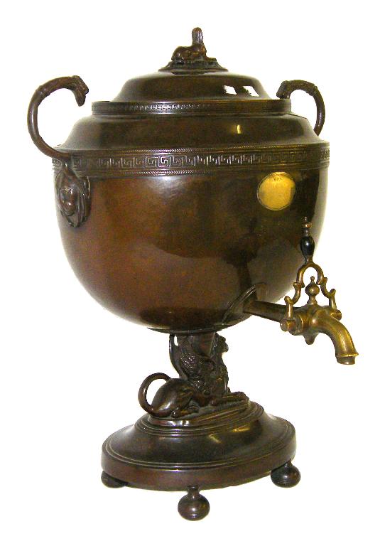 Appraisal: Regency twin handle samovar of oval form with a Sphinx