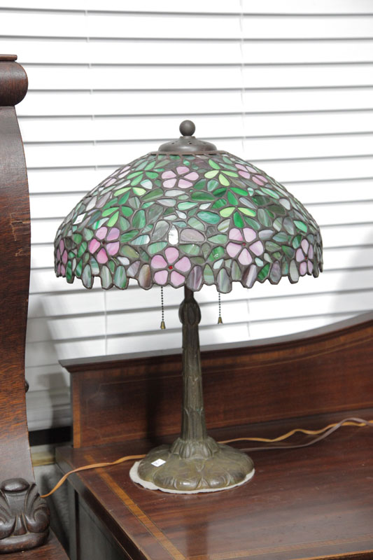 Appraisal: LEADED GLASS TABLE LAMP Lily pad decorated base with a