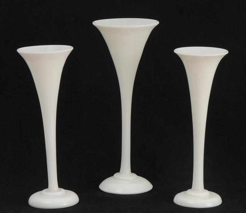 Appraisal: THREE BLOWN OPALINE GLASS TRUMPET-FORM VASES On circular stepped bases