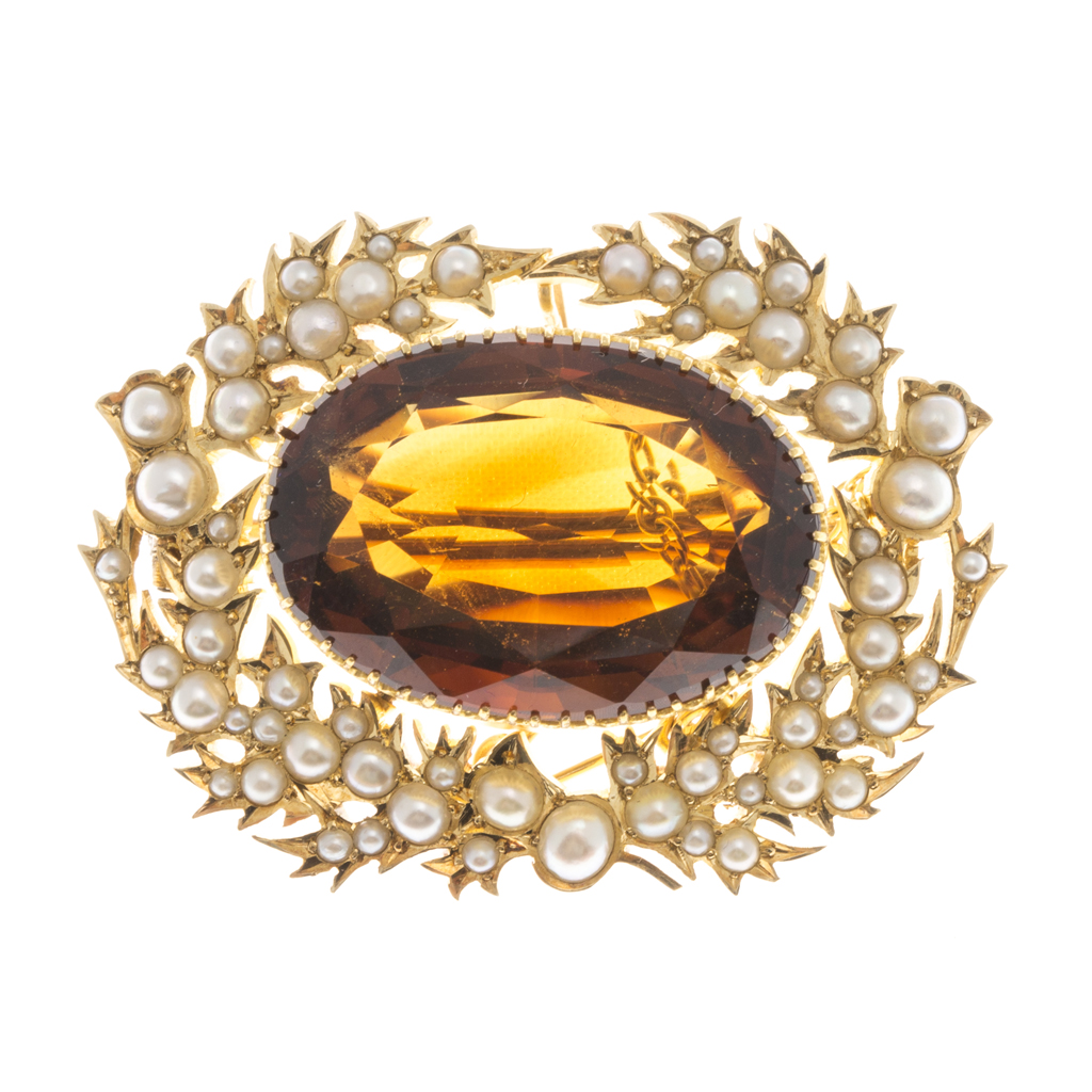 Appraisal: A Victorian cairngorm and seed pearl set brooch the oval