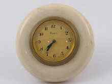 Appraisal: A small gilt metal strut clock mounted in ivory with