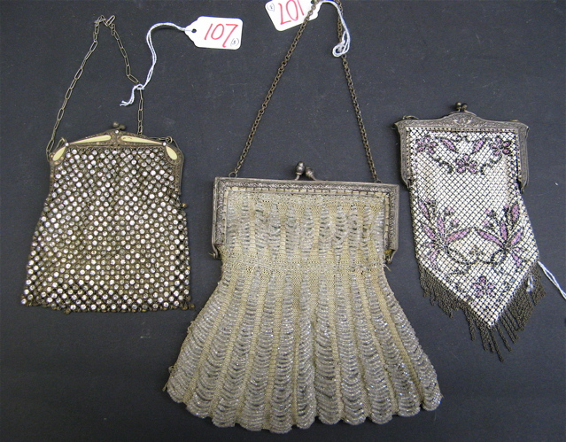 Appraisal: THREE LADY'S EVENING PURSES a clear beaded bag with cloth