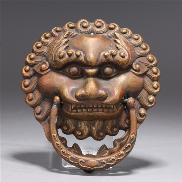 Appraisal: Chinese Bronze door knocker in the form of a lion