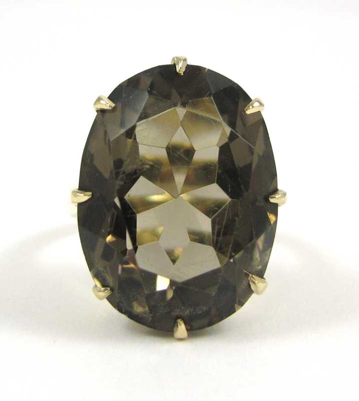 Appraisal: SMOKY QUARTZ AND EIGHTEEN KARAT GOLD RING set with a