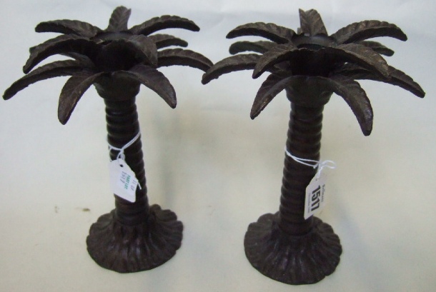 Appraisal: A pair of bronze candle sticks in the form of