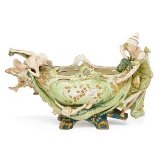 Appraisal: AUSTRIAN STYLE PORCELAIN CENTERPIECE Featuring a female figure and cherubs