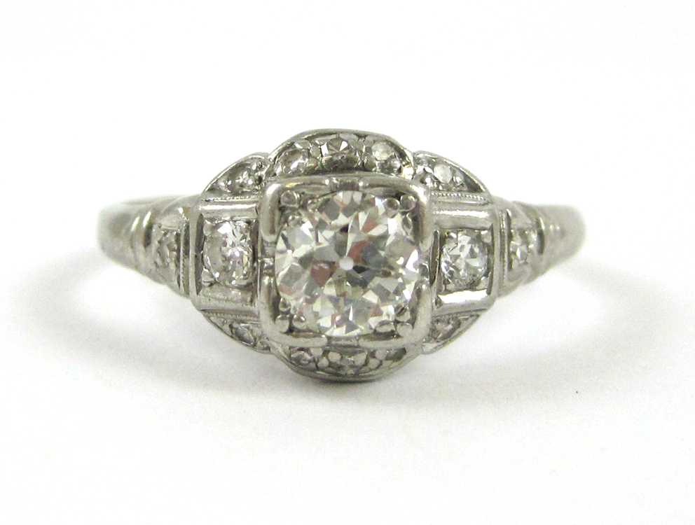 Appraisal: ART DECO DIAMOND AND PLATINUM RING with twelve round-cut diamonds