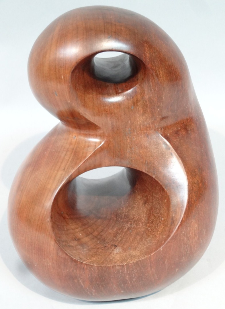 Appraisal: A polished Brazilian walnut sculpture by John Fox with shaped