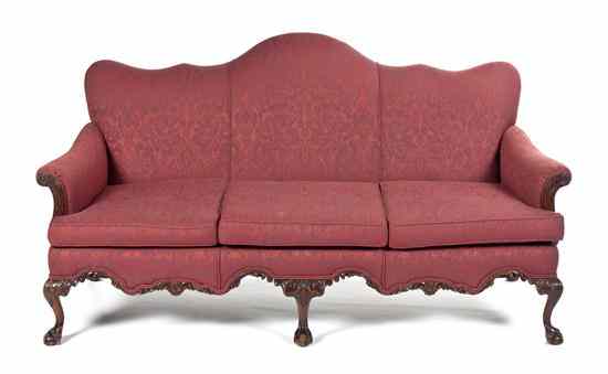 Appraisal: A Victorian Camelback Sofa having an upholstered back arms and