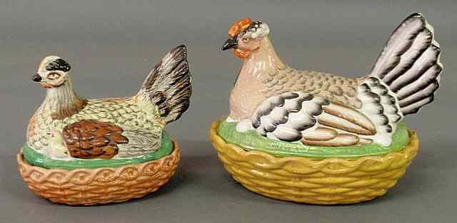 Appraisal: Two colorful th c Staffordshire hens-on-nests largest h x l