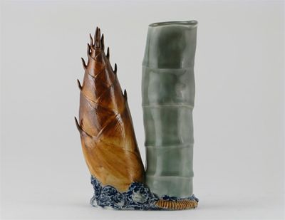 Appraisal: A Japanese porcelain vase modelled as a bamboo stem beside