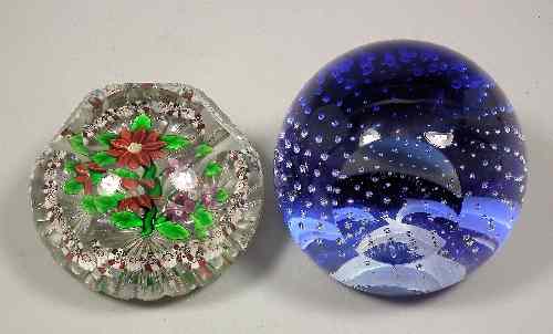 Appraisal: A modern Baccarat style glass paperweight inset with two flowers