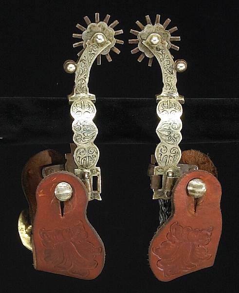 Appraisal: A pair of silver-mounted California style spurs Single mounted heel