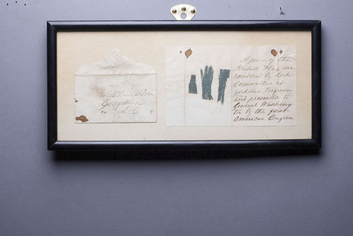 Appraisal: FRAMED REVOLUTIONARY WAR FLAG FRAGMENTS FROM CORNWALLIS'S SURRENDER Consisting of