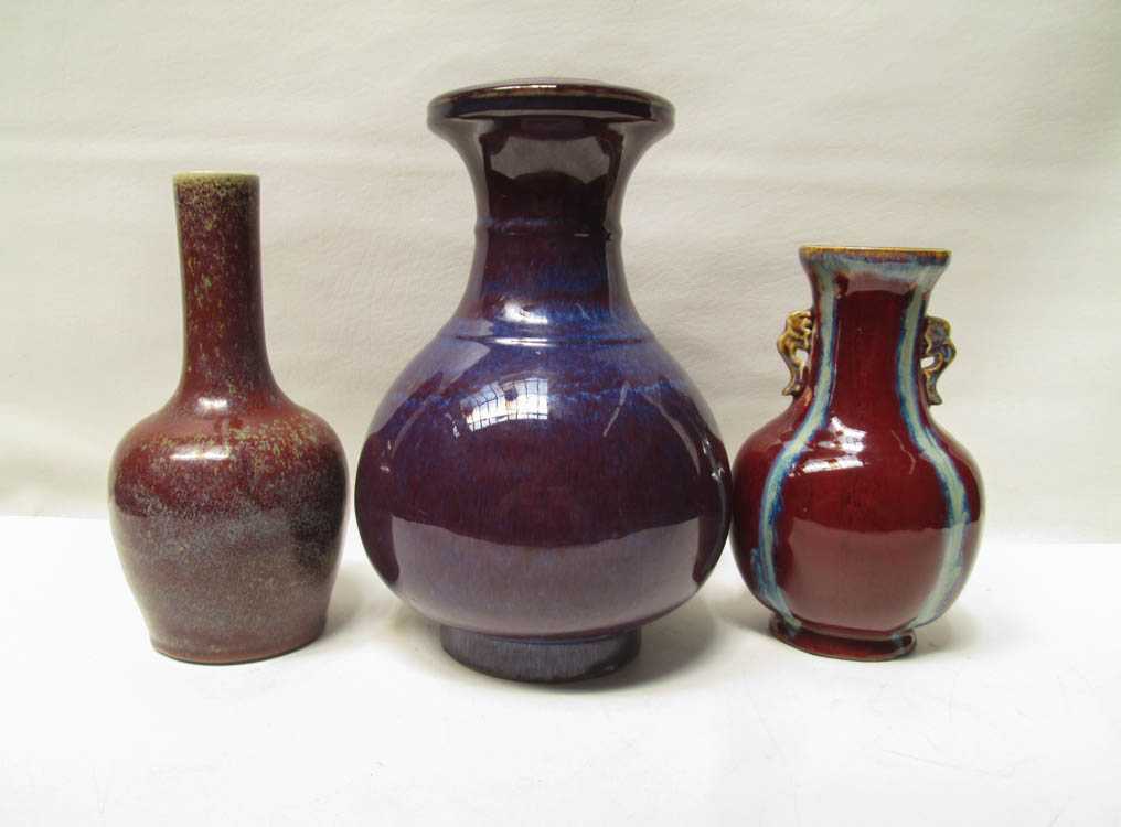 Appraisal: THREE CHINESE FLAMBE VASES baluster form with applied handles incised