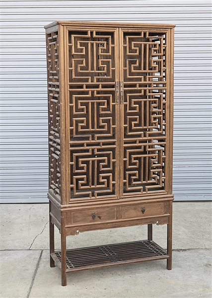 Appraisal: Chinese two piece wood cabinet consisting of lower slat shelf