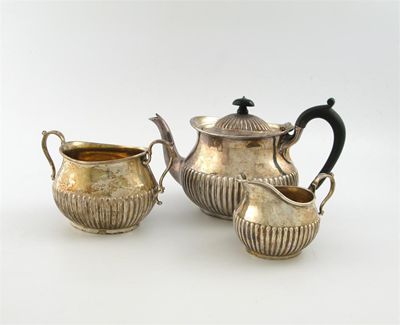 Appraisal: A late Victorian silver half-fluted tea service by Martin Hall