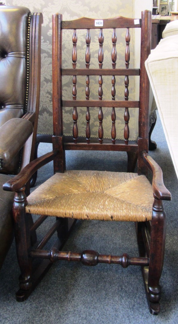 Appraisal: A George III ash spindle back rush seated rocking chair