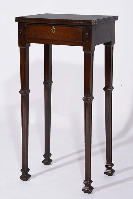 Appraisal: A George III mahogany small reading tablewith fold-over top fitted