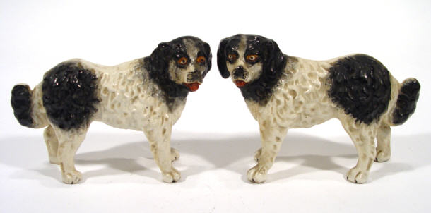 Appraisal: Pair of hand painted 's pottery dogs cm high