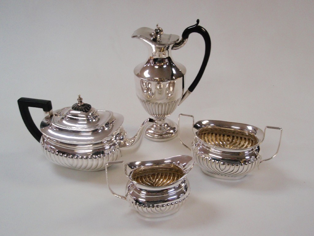 Appraisal: An electroplate part-reeded teaset and a further water jug