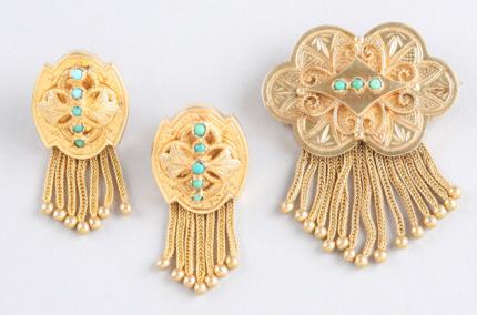 Appraisal: KY accented with small round turquoise cabochons and golden tassels