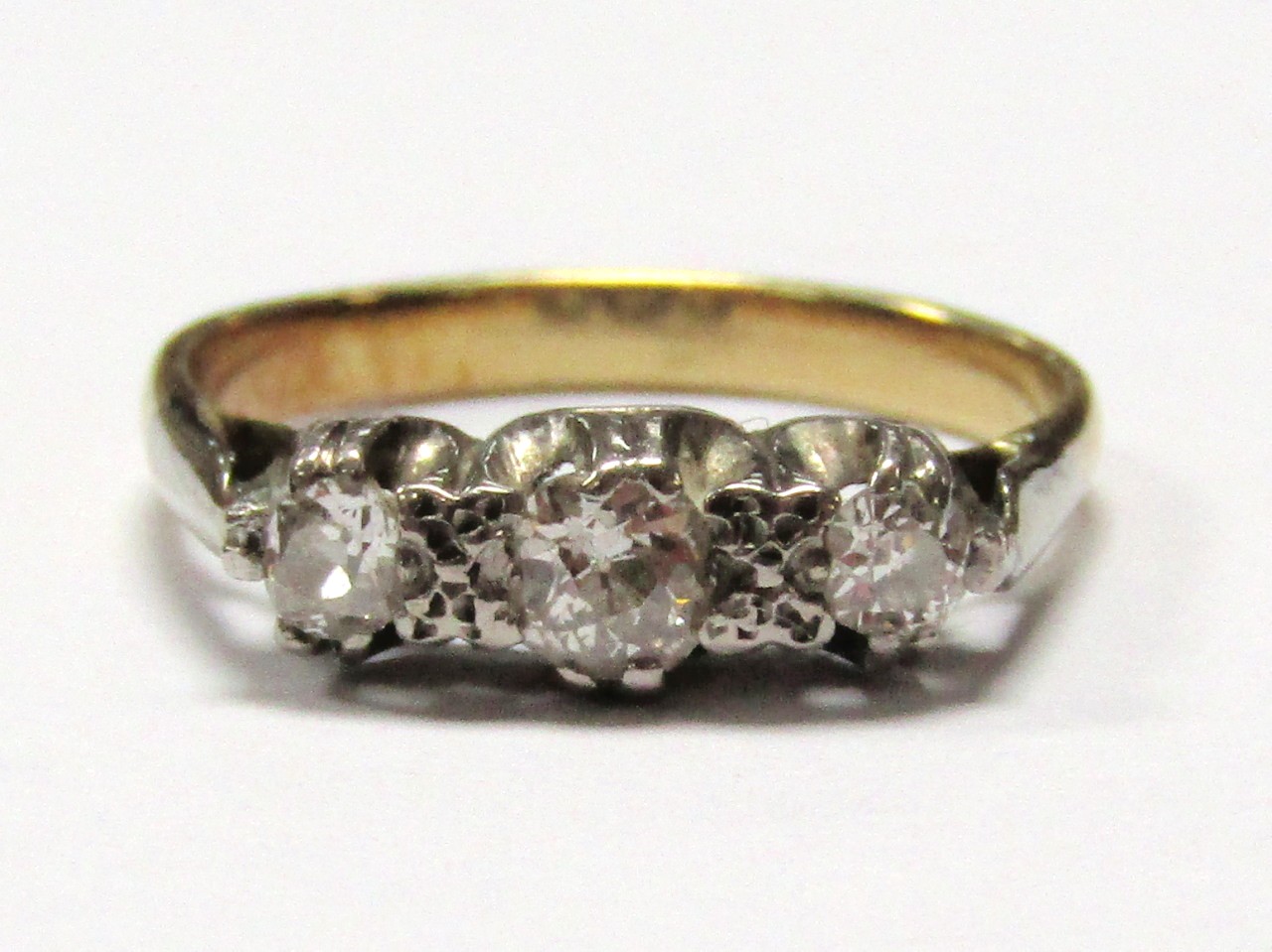 Appraisal: A ladies graduated three stone dress ring on part pierced