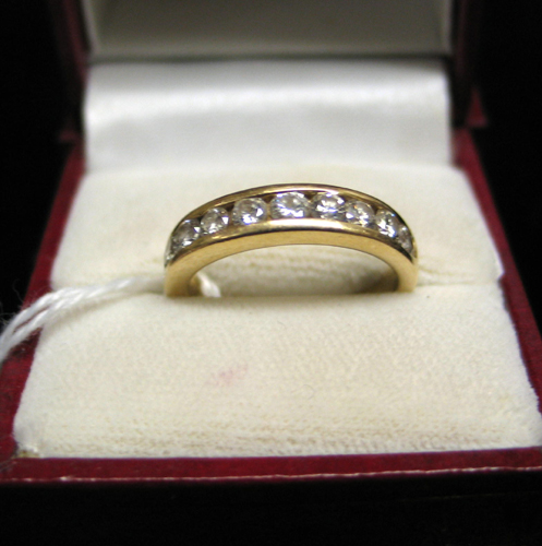 Appraisal: DIAMOND AND FOURTEEN KARAT GOLD RING with ten round brilliant-cut